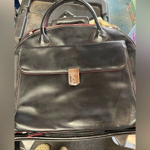 rolling work bag. can be unzipped from roller&  used handheld bag